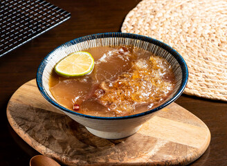 Honey Lemon Peach Gum Aiyu Dessert in bowl side view of taiwan food