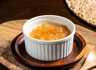 Peach Gum Stewed Milk Dessert in bowl side view of Chinese Sweet Soup