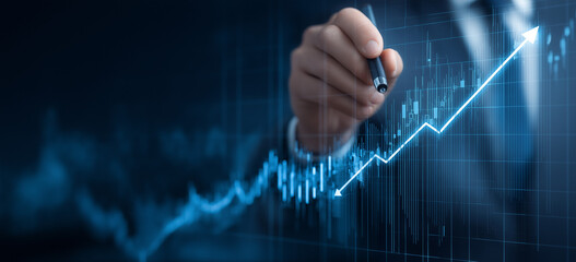 Businessman drawing a growth graph line with a digital screen and business data background for a market or financial banner