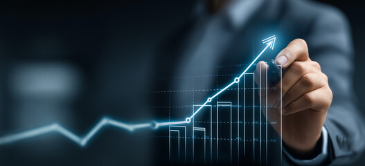 Businessman drawing a growth graph line with a digital screen and business data background for a market or financial banner