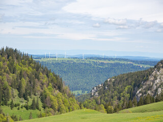 Chasseral, Switzerland - May 26th 2024: Beautiful Jura landscape with Mt. Crosin and its wind engines.