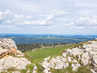 Chasseral, Switzerland - May 26th 2024: View from the summit ridge towards Mont Crosin with wind engines