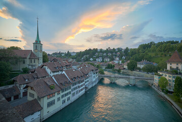 Fototapeta premium Aerial view at sunset of the old town and the river Aar in Bern in Switzerland.