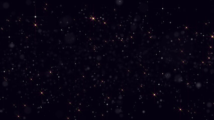 Animation of abstract yellow flickering particles in motion on a black background; golden orange shining particles focus