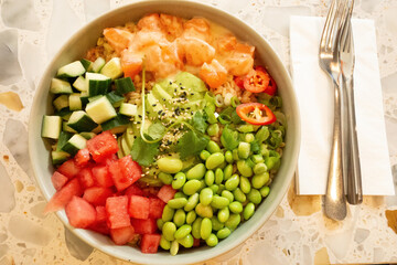 Colorful bowl of fresh vegetables and seafood with vibrant toppings and healthy ingredients