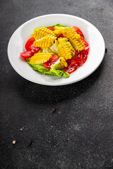 Corn salad tomato fresh vegetables snack fresh delicious gourmet food background on the table  rustic food top view copy space keto and paleo diet vegetarian and vegan food