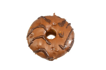 chocolate topping and sauce on a fried sweet donut, a doughnut or donut, a type of food made from leavened fried dough, usually deep fried from a flour dough, various toppings and flavors used