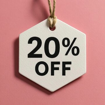 A close-up shot showcases a clean, modern price tag hanging against a soft pink background, prominently displaying the 20% OFF promotional text, perfect for commercial use.