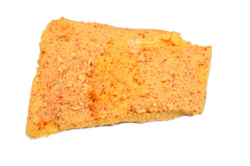 Slice of Yellow Feta cheese with turmeric and pepper, Feta is a Greek brined white cheese made from sheep milk or from a mixture of sheep and goat milk, soft, with small or no holes, and no skin