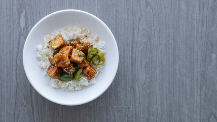 Plate of Stir Fried Tofu Over Rice