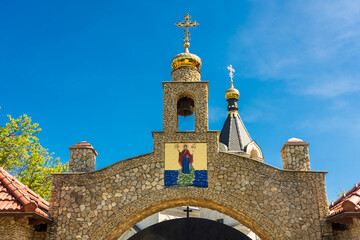 Obraz premium Golden domes of the Orheiul Vechi Monastery in Butuceni, Moldova