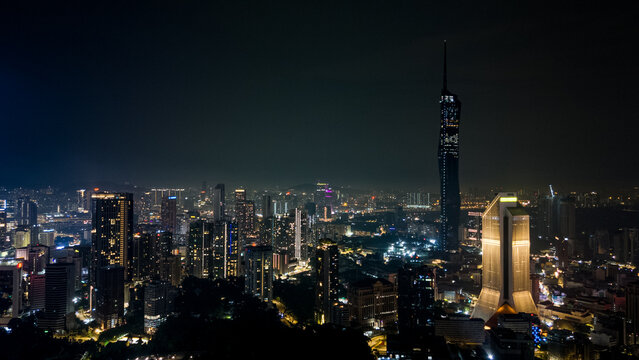 Aerial view of the Merdeka 118 skyscraper piercing the night sky, its lights reflecting in the city below, Kuala Lumpur, Federal Territory of Kuala Lumpur, Malaysia.