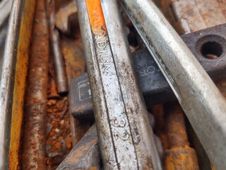 Close-up of Rusted Metal Tools and Parts in Workshop