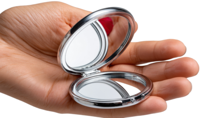 A Mirror's Reflection: A handheld, open compact mirror gleams in a gentle display, mirroring its surroundings, embodying the essence of grooming and self-care with a subtle touch of elegance.