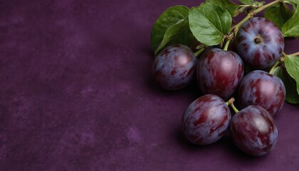 Fresh ripe purple plums with green leaves on a textured purple background. Juicy fruit with natural sweetness perfect for healthy eating. Delicious organic plums offer a vibrant color and rich flavor.