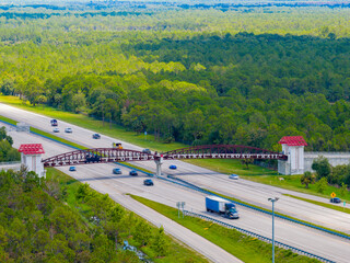 Naklejka premium Aerial telephoto Trans Florida Central Railroad Trail over I95