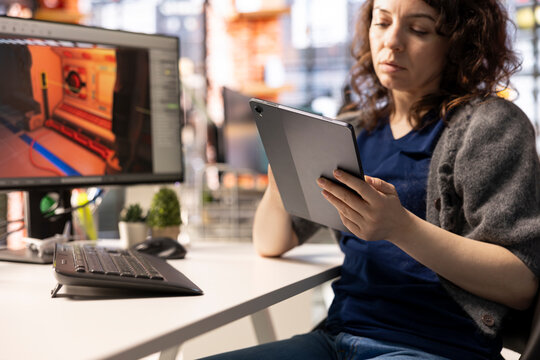 Young woman takes notes and uses AI chatbot to develop a sci fi game, working with artificial intelligence app to design a futuristic Mars station and spaceship. Virtual environments in real time.