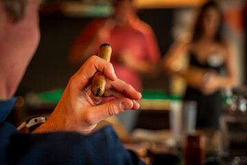 Hand Holding A Cigar