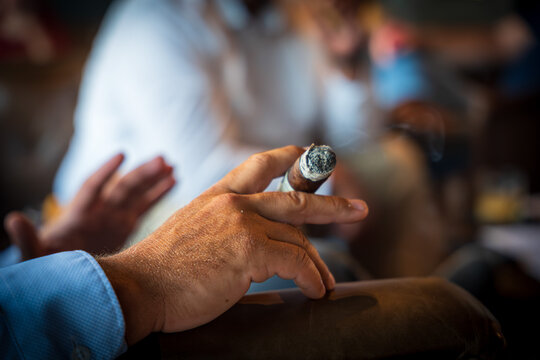 Hand Holding A Cigar