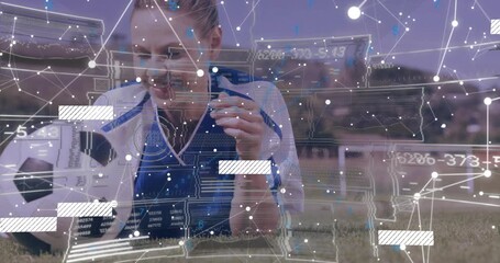 Transparent overlay appearing over soccer ball and driving female player nudging and analyzing data - Powered by Adobe