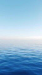 Obraz premium Beautiful seascape with blue sky reflected in water surface.