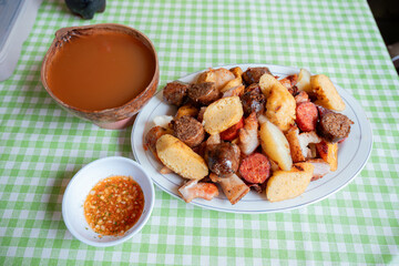 Colombian Picada with Traditional Guarapo and Hot Sauce