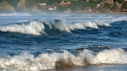 Waves breaking on the beach in Zipolite, Mexico