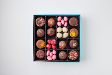 blue chocolate box filled with mixed candy and truffles with decorative toppings perfect for birthday gift mother day present candy shop bakery gift box design branding layout product photography,