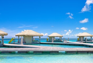 Cabanas situated on a dock in a vacation location