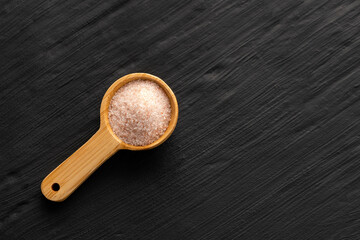 Himalayan pink fine salt - Salt in pure crystals on the spoon.