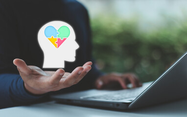 Mental Health and Wellness Concept. Hand holding puzzle brain icon representing mind care and psychological wellbeing, emotional balance, healthcare, education, campaign, program and personal growth.