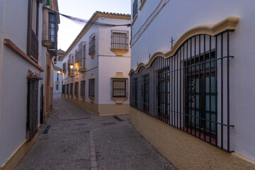 Beautiful street in the old town of the city of Ronda at night. Malaga, Andalucia, Spain.