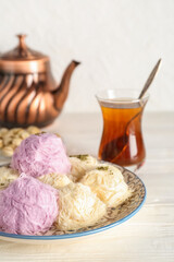 Plate with tasty Turkish Pismaniye on table