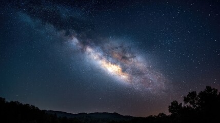 Naklejka premium Milky Way across a dark night sky