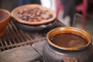 Traditional Mayan chocolate making in Guatemala with cacao beans and comal plate