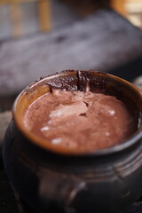 Traditional Mayan chocolate making in Guatemala with cacao beans and comal plate