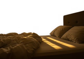 Sunlight streaming across a made bed isolated on transparent background