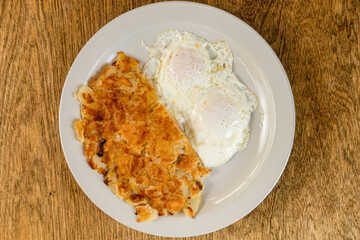 Two eggs with hash browns