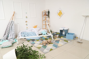 Broken bed with toys on carpet in messy children's room