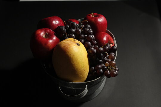 Assorted fruits including red apples, yellow pears, and green apples arranged on a white surface. Fresh, sweet, and perfect for health, diet, or vegetarian meals.