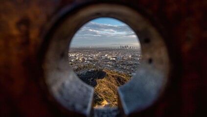 Cityscape viewed through a keyhole-shaped opening