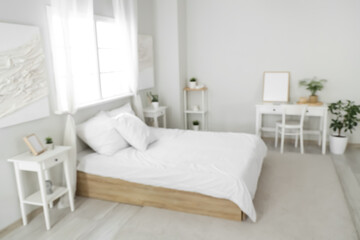 Interior of modern stylish comfortable bedroom, blurred view