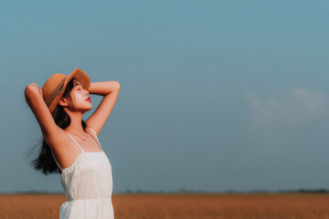 Obraz premium woman joyfully embraces her hat feeling freedom of wind against her skin