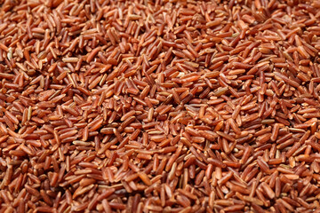 Raw brown rice as background, closeup