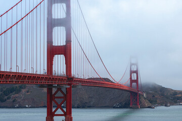 Golden Gate Bridge In San Francisco With Fog Over Hills
