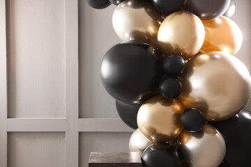 Stylish photo zone with balloons in studio, closeup. Space for text
