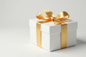 Luxury white gift box tied with a golden ribbon bow, clean background , product photography, christmas