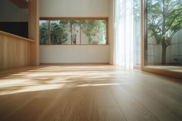 Bright modern interior with light wood floor and sunlight through windows