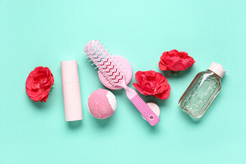 Composition with hair brush, cosmetic products and beautiful rose flowers on color background