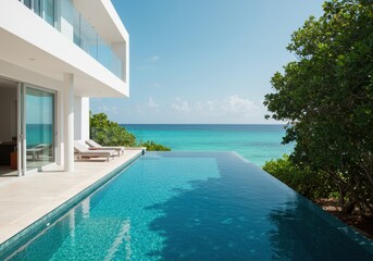 Fototapeta premium Modern villa with infinity pool overlooking the turquoise ocean